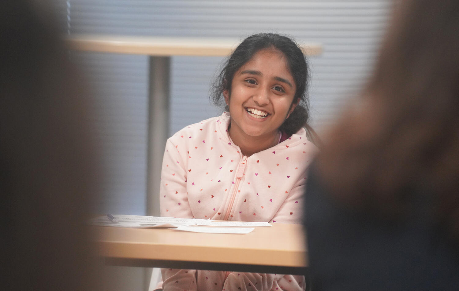 Ariyah, a rising sixth grader at The Compass School, smiles at panelists during the debate on lowering the voting age.