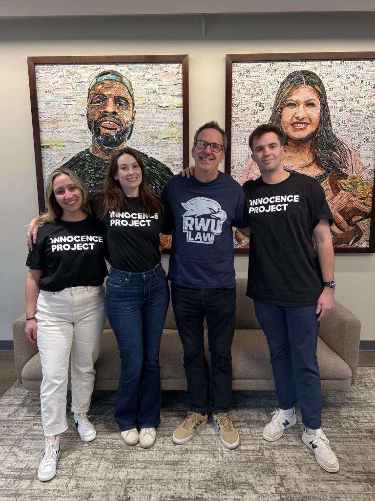 Group picture of 2 females and 2 males with 3 wearing Innocence Project name on the front of their shirts and wearing RWU Law logo printed on the front of the shirt
