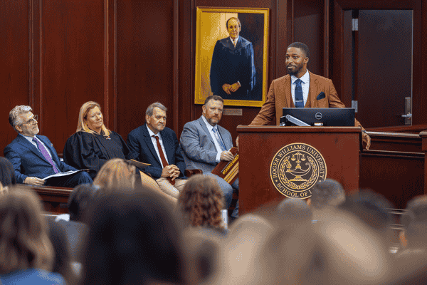 Student Bar Association President speaking before incoming class 