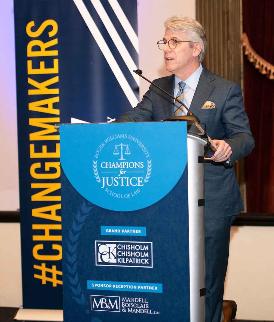 Man speaking on a rostrum