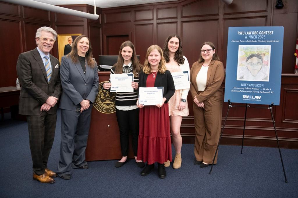 2025 RWU Law RBG Winners announced at the RWU Women in Law Leadership Lecture on March 5, 2025. (L to R) Gregory W. Bowman, RWU Law Dean; Emily J. Sack, RWU Law Professor; Middle School Category - Catherine Harley - Broad Rock Middle School, Grade 7; Elementary School Category - Wren Anderson - Richmond Elementary School, Grade 4; High School Category - Hazel Bradley - Mt. Hope High School, Grade 10; Meghan Graham L’25, RWU Law Women’s Law Society President.