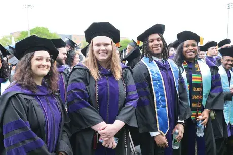 Soon to be graduates take their seats during the Commencement ceremony.