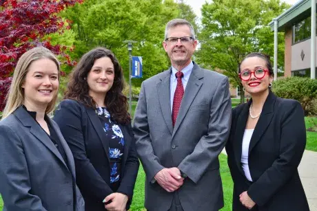 Four RWU Law Feinstein awardees in front of law school building
