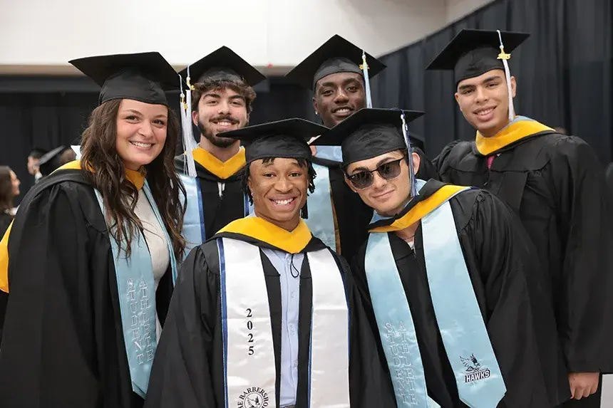 Graduates pose together