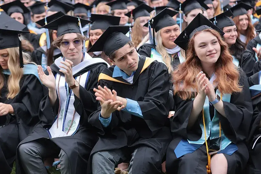 Graduates applaud speeches